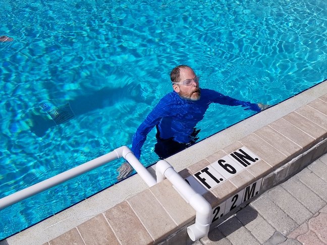 adults learn to swim by overcoming fear of deep water and fear of swimming