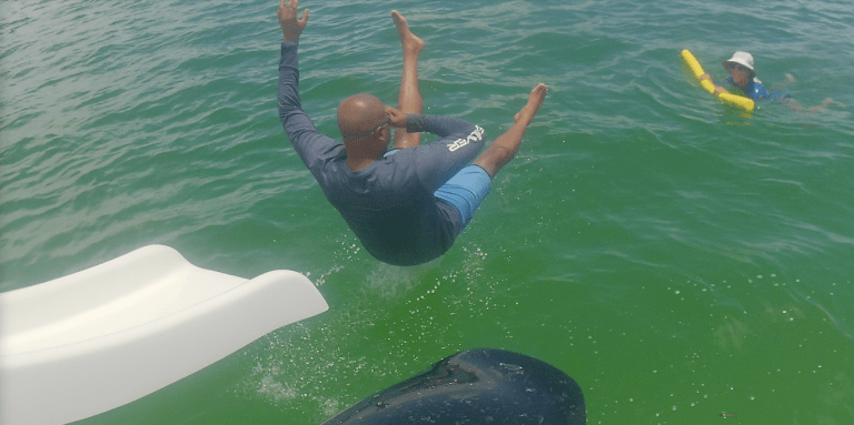 adult swimming lessons where adults learn to swim and overcome fear of swimming in the ocean